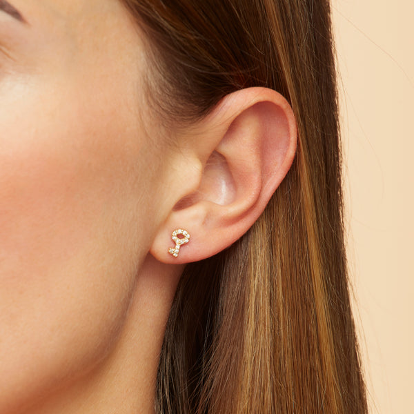 Our 14K gold diamond earring studs with a handset diamond pave are the ultimate love symbol. Lock and key diamond earrings.