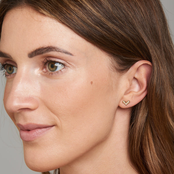  pair of magical 14 karat gold diamond earrings that will become your day to night companion.   These delicate and sophisticated heart earrings sparkle by themselves as well as mixed and matched with other earrings. 