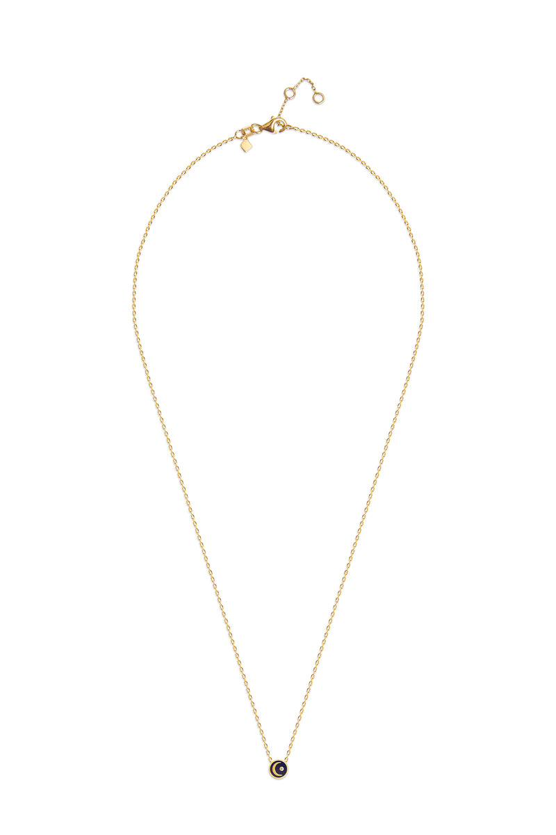 This handmade 14 karat gold diamond necklace is the perfect every day gold accessory. Its pendant features a hand-painted and two-sided blue enamel with a moon and a shining diamond star.