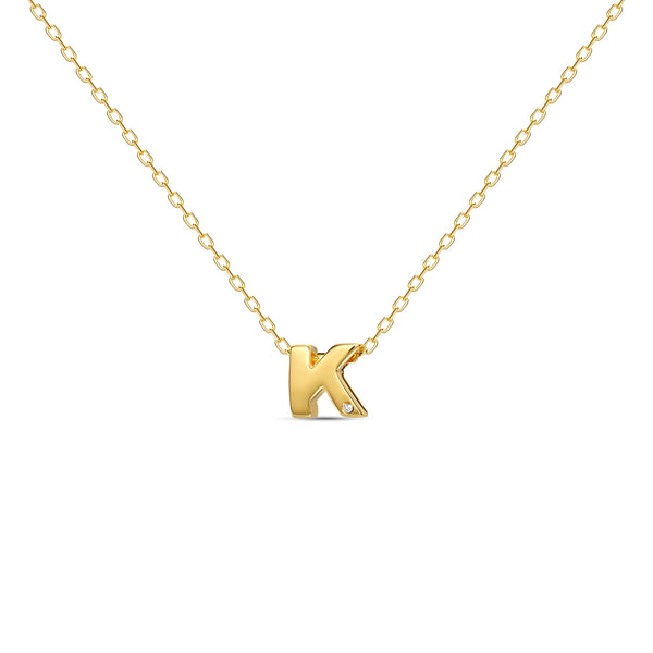 A 18 karat gold vermeil necklace with your initial letter "K". This diamond letter necklace is a special jewelry necklace that can be worn day and night. A genuine diamond stone in the corner of the letter makes this gold diamond necklace a luxury and ideal gift for yourself, your best friend or loved one. 