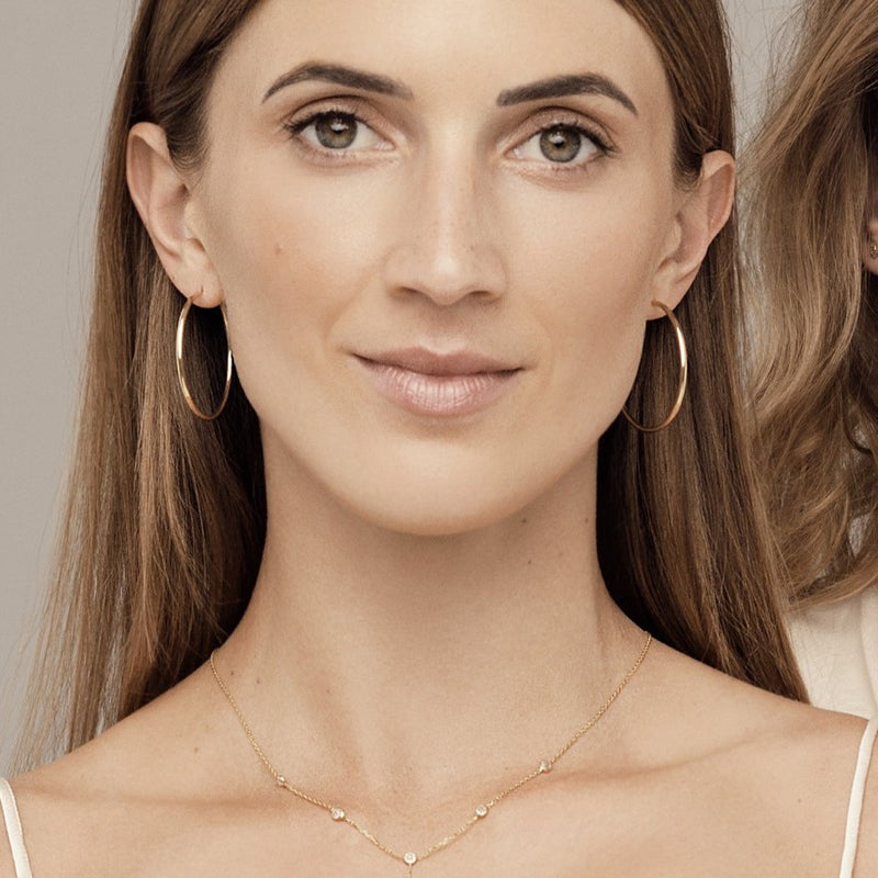 This 14 karat gold hoop earring measures 38mm and is one of our favorite essentials. Despite their size, these earrings are very comfortable and light. 