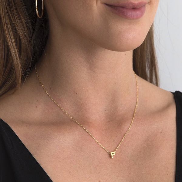 A 18 karat gold vermeil necklace with your initial letter "P". This diamond letter necklace is a special jewelry necklace that can be worn day and night. A genuine diamond stone in the corner of the letter makes this gold diamond necklace a luxury and ideal gift for yourself, your best friend or loved one.